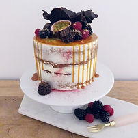 Semi naked single tier brown butter and chocolate chunk cake with rich caramel.