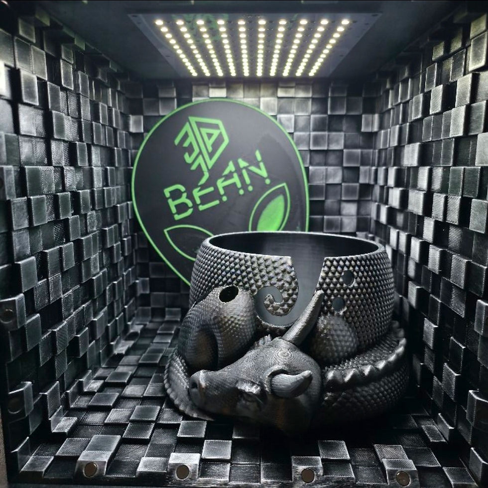 A bowl in the shape of a silver and black dragon curled up that could hold yarn and tools for knitting