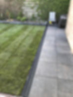 Aanleg nieuwe bestrating, gazon en goot