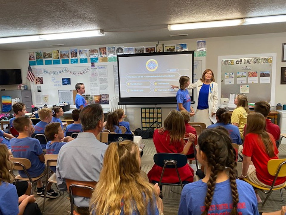 Susan Dransfield of the DAR instructs students about the importance of the Constitution and service for others to eighth graders of Matt Evans at Enterprise High School. Image from Daughters of the American Revolution, Color Country Chapter.