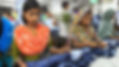 Indian girls inspecting jeans