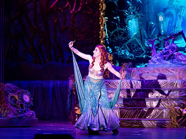 Image of Narée Asherian onstage dressed as Ariel from "The Little Mermaid"