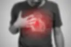 A person holding his chest with a floating image of a heart on it representing an arrhythmia