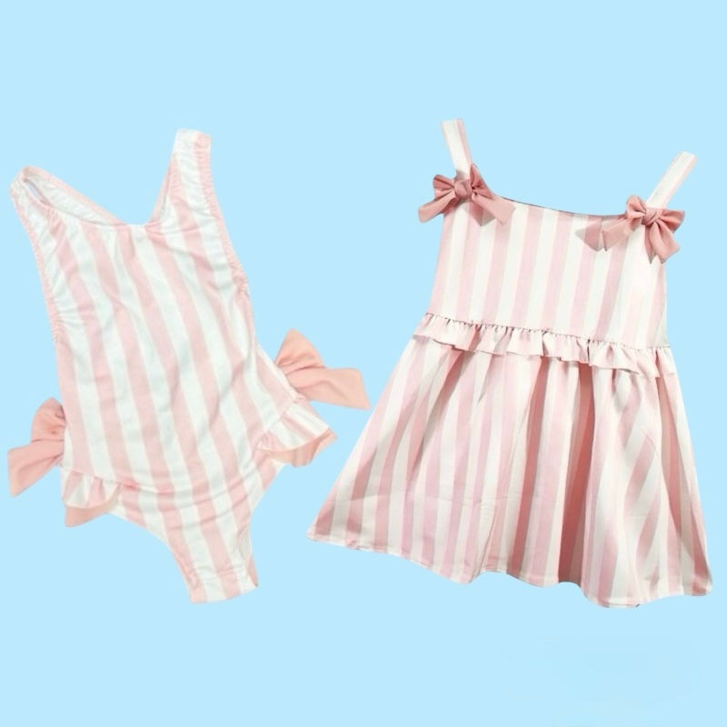 Boys swimming trunks with pink and white stripes and matching girls swimsuit and dress