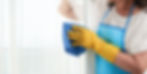 cropped-woman-cleaning-window-wearing-special-apron_edited.jpg
