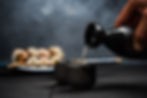 man-pouring-sake-into-sipping-bowl-2021-08-26-16-37-21-utc.jpg