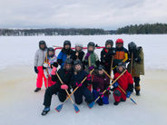 Grade 4 + 5 students at Pine Crest playing Broomball