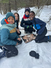 Grade 4 + 5 students at Pine Crest learning to make fires