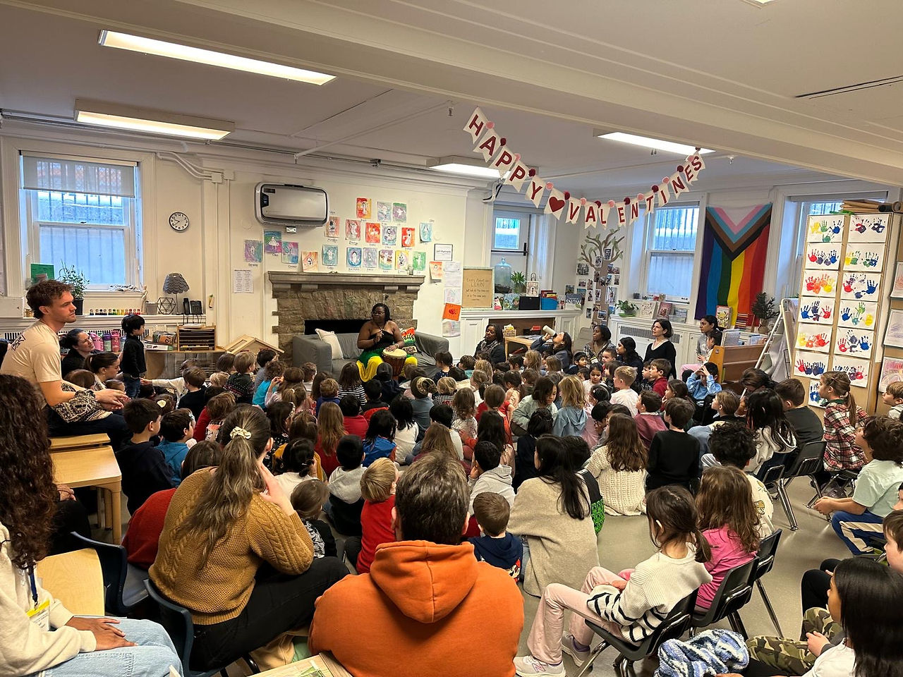 class full of children with a speaker