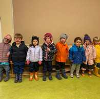 children in rain gear lined up