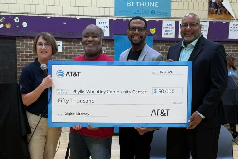 AT&T surprises Northside families with free MacBooks at Phyllis Wheatley back-to-school event