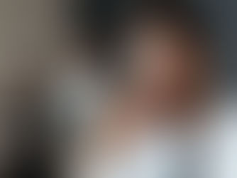 Leader standing before mirror with empowered reflection, symbolizing reflective leadership and continuous growth