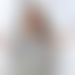 Woman in a striped shirt meditates with closed eyes at a desk, surrounded by hands holding documents. Logo: "Blue Collar Consulting".