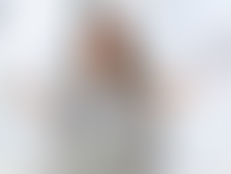 Woman in a striped shirt meditates with closed eyes at a desk, surrounded by hands holding documents. Logo: "Blue Collar Consulting".