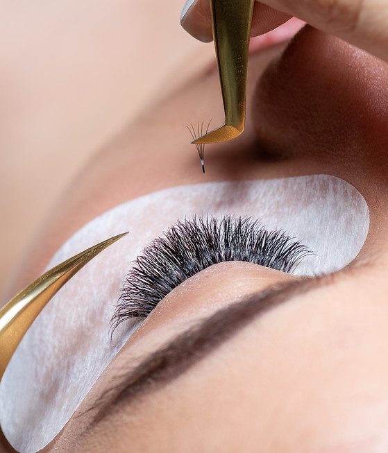 model looking at camera showing makeup, hair, nails