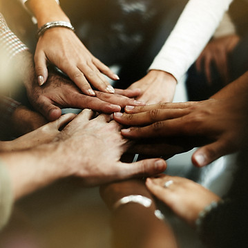 closeup-of-diverse-people-joining-their-hands.jpg