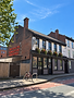 Sunny riverside pub with bicycle.png
