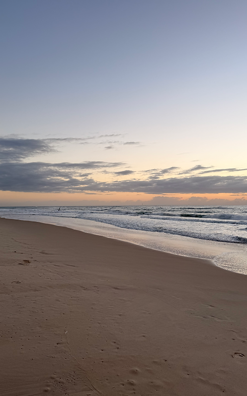 Australian beach at sunrise representing the adventurous western lifestyle behind Wyld Revolution Co apparel.