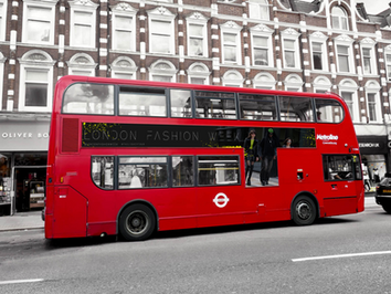 Red London bus featuring The Legacy Tour branding during London Fashion Week, representing experiential fashion marketing and campaign activation