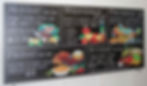 Restaurant chalkboard specials menu featuring illustrated food artwork and promotional offers.