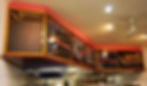 Restaurant menu board system mounted above service counter.