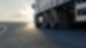 truck-is-driving-along-road-3d-image-3d-rendering.jpeg