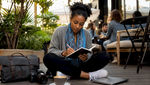 Photographer browsing photography events in coffee shop