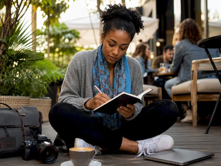 Photographer browsing photography events in coffee shop