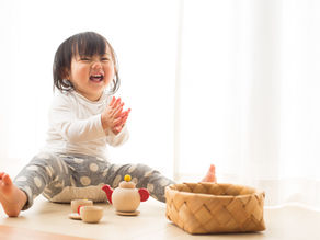 Happy girl laughing and clapping her hands