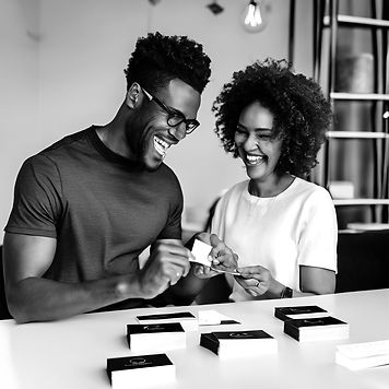 happy black client getting business cards from black designer.jpg
