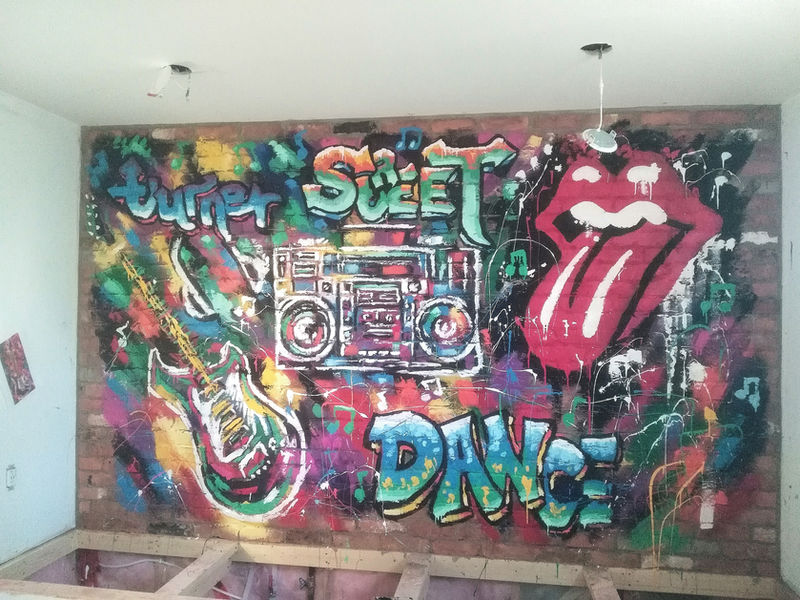 Custom gameroom graffiti. Art painted on brick wall.