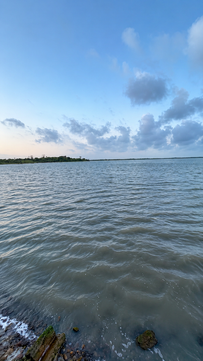 Corpus Christi kayak fishing waters under a blue sky.