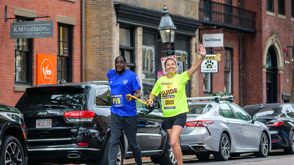 Larry Haile with his guide at the start of the Boston 10K on Charles Street on Sunday June 22, 2025.