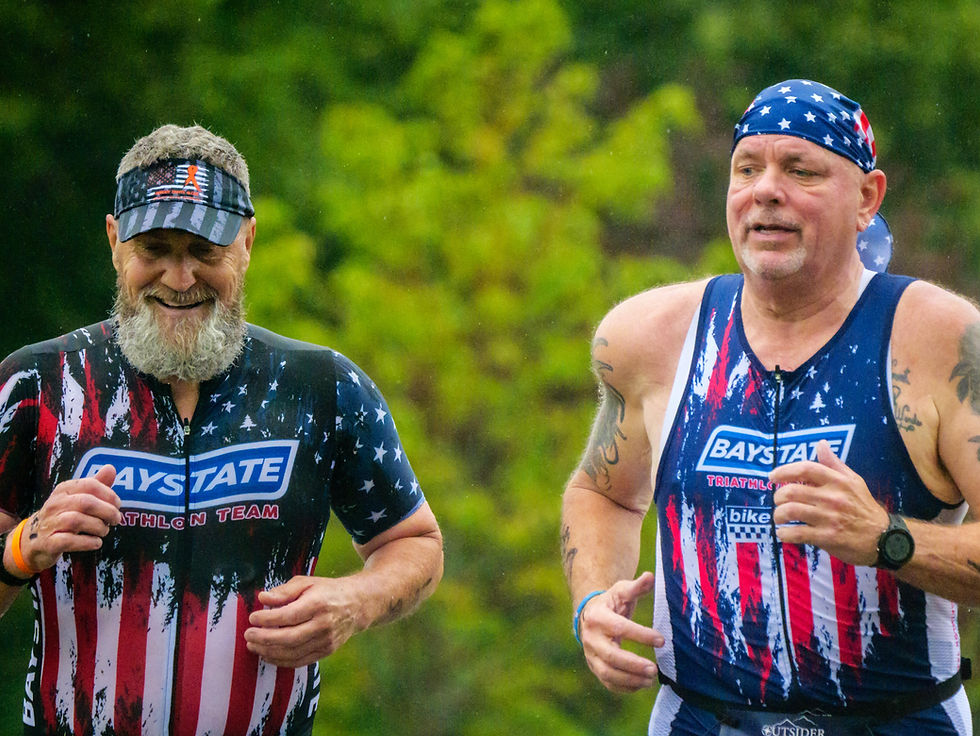 Baystate Triathlon teammates Kevin Sharland (l) and Roger Hanks during the first mile of the run portion at the sprint triathlon at the Whaling City Tri & Du July 20, 2025 in New Bedford, MA.
