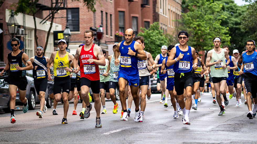 Runners on Charles Street at the start of the Boston 10K on Sunday June 22, 2025.