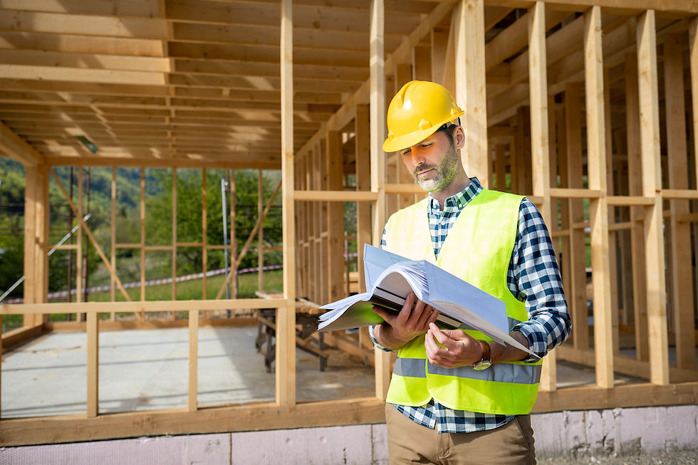 engineer-with-hardhat-and-blueprints-on-