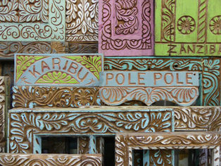 Beautifully engraved wooden frames and signs in Stonetown, Zanzibar