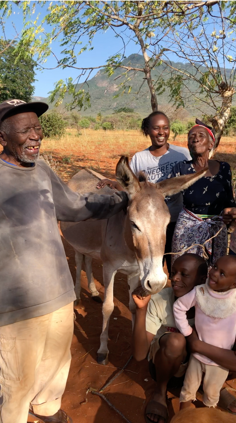 Mwanjovu, also known as Babu which means Grandfather, with the donkey Kabisa have gifted the family