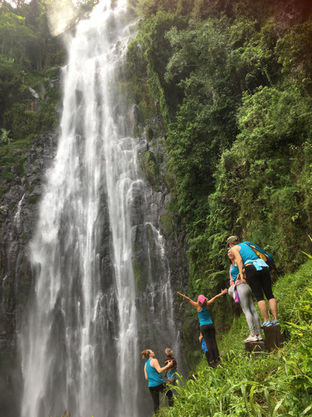 The Kabisa Experience group admiring Materuni waterfalls in the foothills of Kilimanjaro, Tanzania