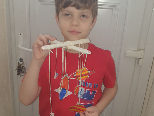This boy has made his own model of the Solar System. What a clever idea!