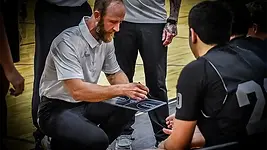 Coach Brad in huddle at tournament in keller