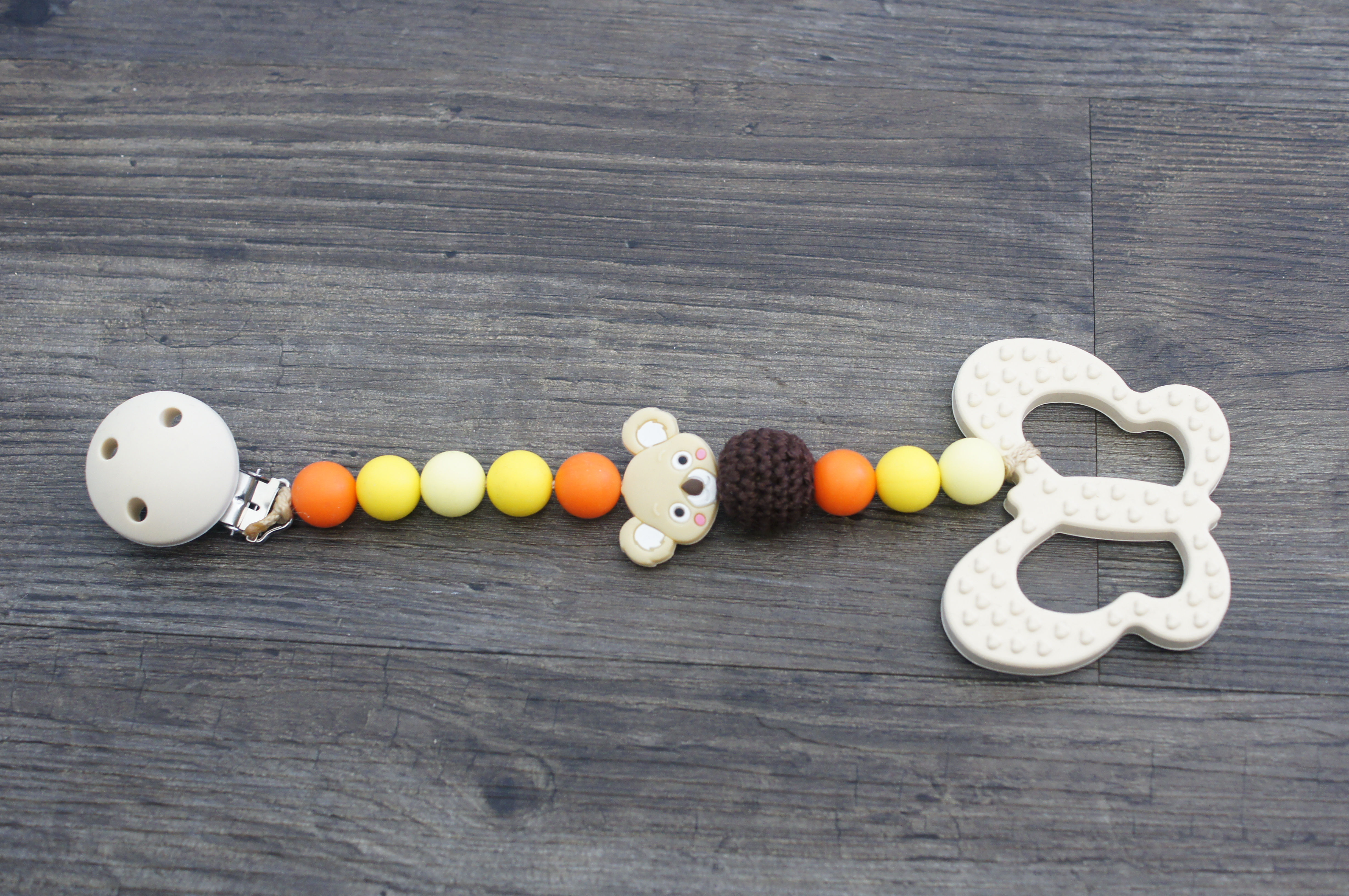 Beissringkette gelb/Orange  mit Schmetterling