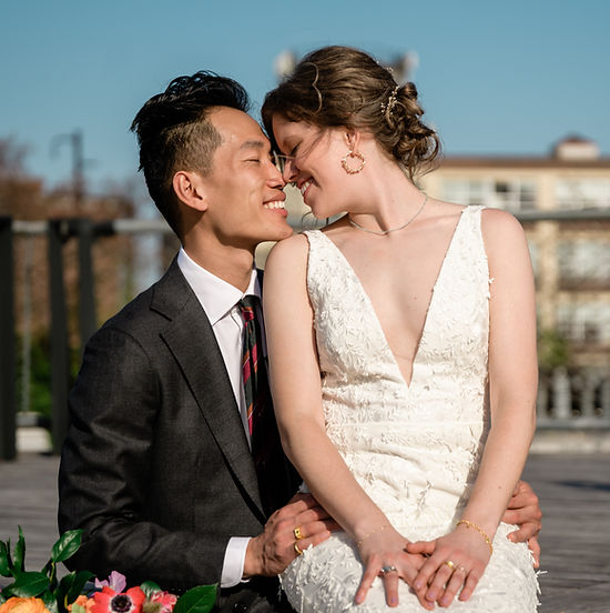 Couple kissing outdoors during a romantic engagement portrait session