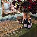 nyetimber English sparkling wine bottles and flute glasses filled with chilled champagne, on top of a clothed table