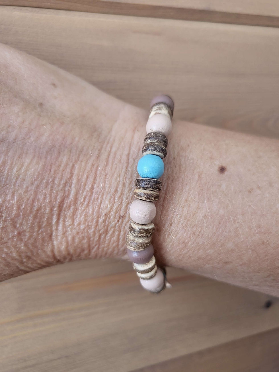 Thumbnail: Natural wood beaded bracelet on soft brown leather cord