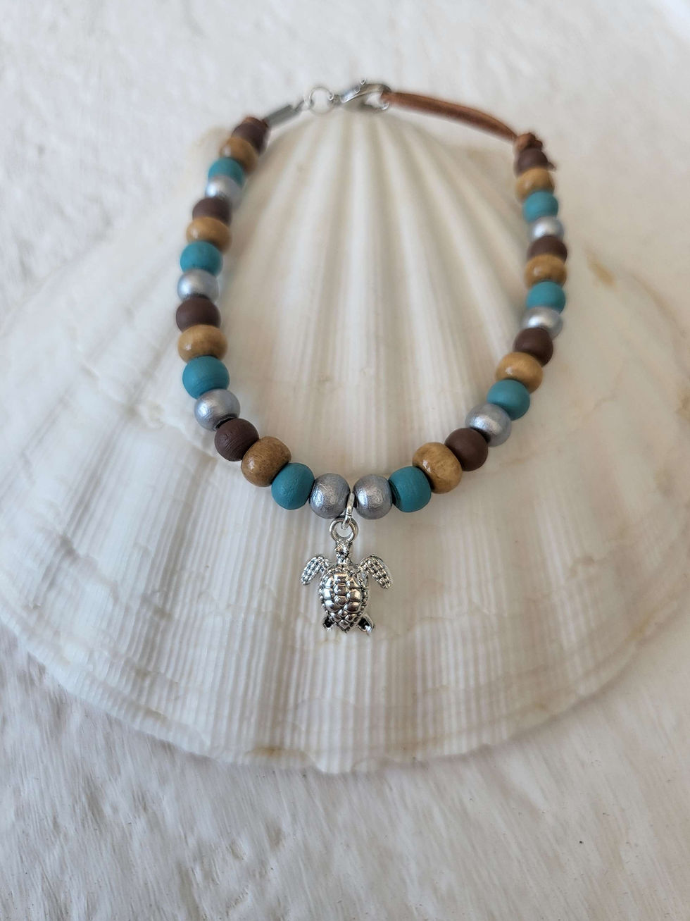 Thumbnail: Natural wooden beaded bracelet, handmade with choice of beach charms.