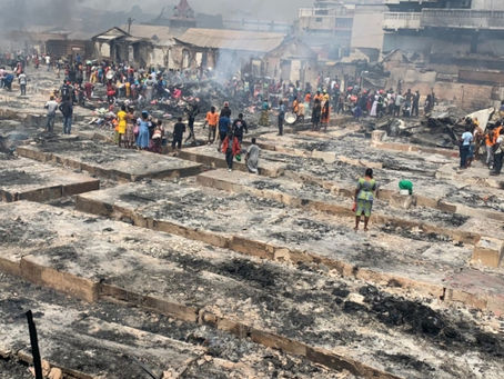 Scrap dealers salvage metal items from Kantamanto fire