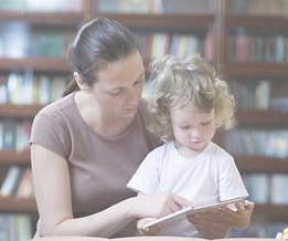 Mother parent mom and toddler Reading a Book together - baby reading coaching practice offers virtual meetings, work with you monthly to provide training and support for teaching baby toddler to read - no lessons, just games tailored to baby's age and interests. It can easily be implemented in homes with working parents, stay-home parents, single parents, blended families, and/or alternate caregivers. Coaching sessions can be arranged at times that are convenient for you, accommodating your work and family schedules.