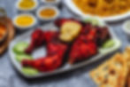 side-view-baked-chicken-with-cucumber-lemon-seasoning-bread-table.jpg