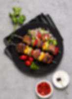 delicious-arabic-fast-food-skewers-black-plate.jpg